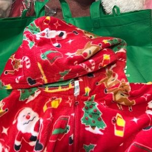 A holiday onesie with Santa and Rudolph dabbing